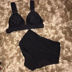 High waisted black swim bottoms.